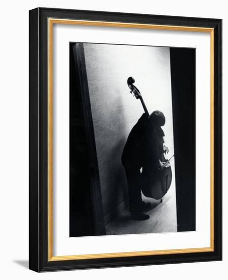 Young Bassist Member of Alexander Schneider's New York String Orchestra Tuning His Instrument-Gjon Mili-Framed Photographic Print