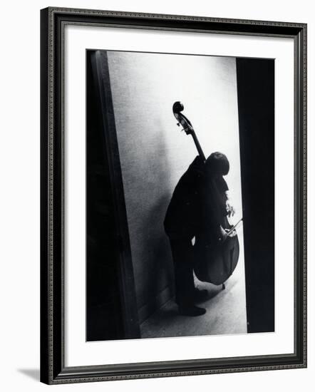 Young Bassist Member of Alexander Schneider's New York String Orchestra Tuning His Instrument-Gjon Mili-Framed Photographic Print