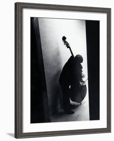 Young Bassist Member of Alexander Schneider's New York String Orchestra Tuning His Instrument-Gjon Mili-Framed Photographic Print