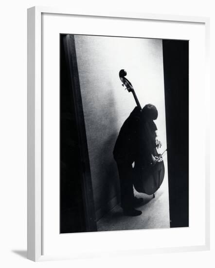 Young Bassist Member of Alexander Schneider's New York String Orchestra Tuning His Instrument-Gjon Mili-Framed Photographic Print