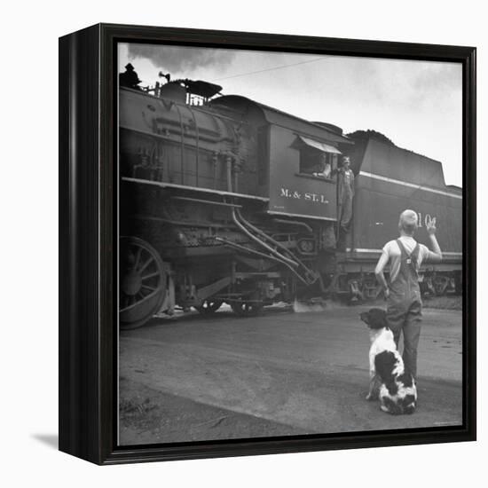 Young Boy and His Dog Standing at the Crossing as a Train Rides Through-Myron Davis-Framed Premier Image Canvas