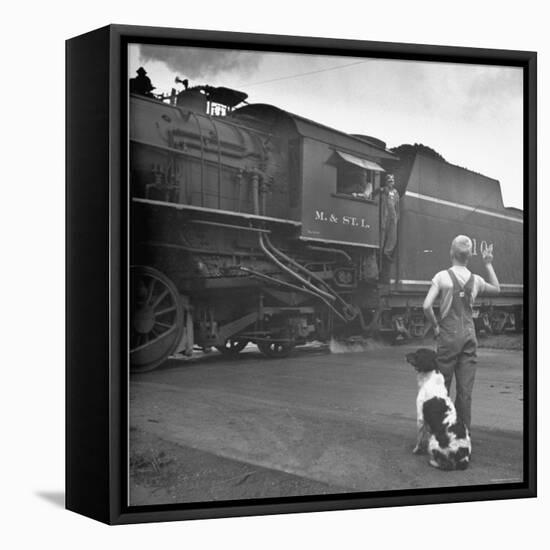 Young Boy and His Dog Standing at the Crossing as a Train Rides Through-Myron Davis-Framed Premier Image Canvas