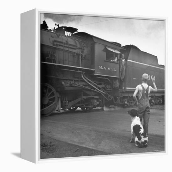 Young Boy and His Dog Standing at the Crossing as a Train Rides Through-Myron Davis-Framed Premier Image Canvas