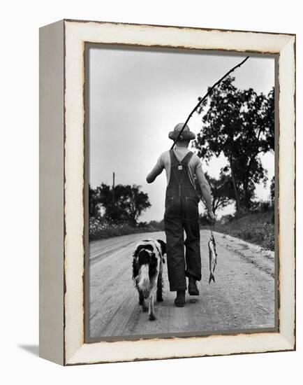 Young Boy and His Dog Walking Home from Fishing-Myron Davis-Framed Premier Image Canvas