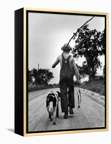 Young Boy and His Dog Walking Home from Fishing-Myron Davis-Framed Premier Image Canvas
