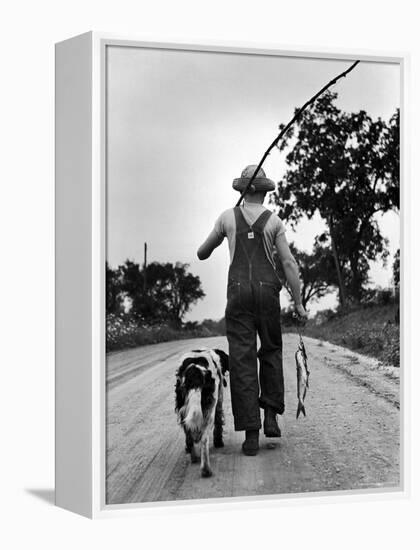 Young Boy and His Dog Walking Home from Fishing-Myron Davis-Framed Premier Image Canvas