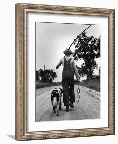 Young Boy and His Dog Walking Home from Fishing-Myron Davis-Framed Photographic Print