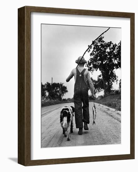 Young Boy and His Dog Walking Home from Fishing-Myron Davis-Framed Photographic Print