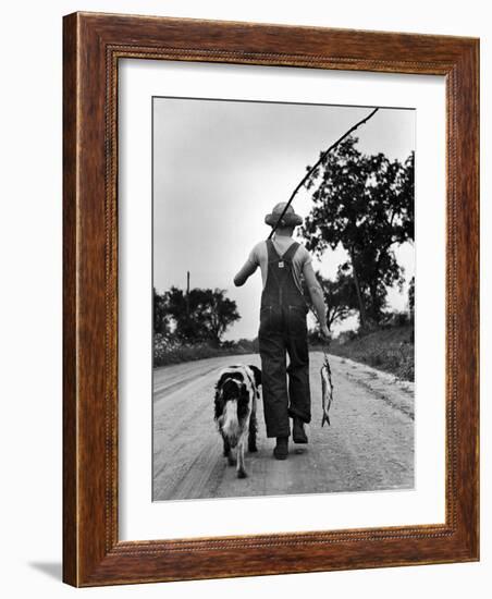 Young Boy and His Dog Walking Home from Fishing-Myron Davis-Framed Photographic Print