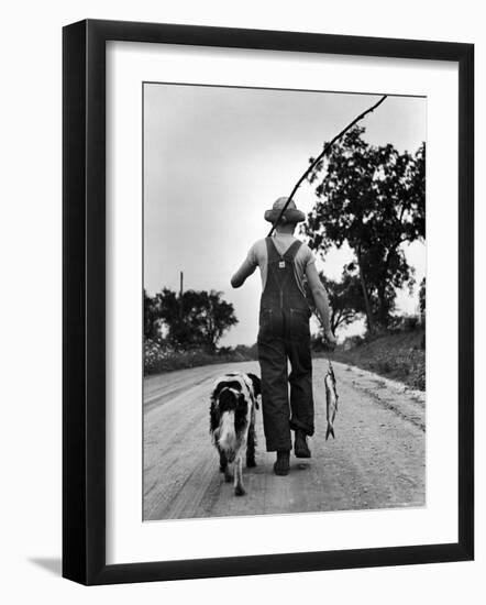 Young Boy and His Dog Walking Home from Fishing-Myron Davis-Framed Photographic Print