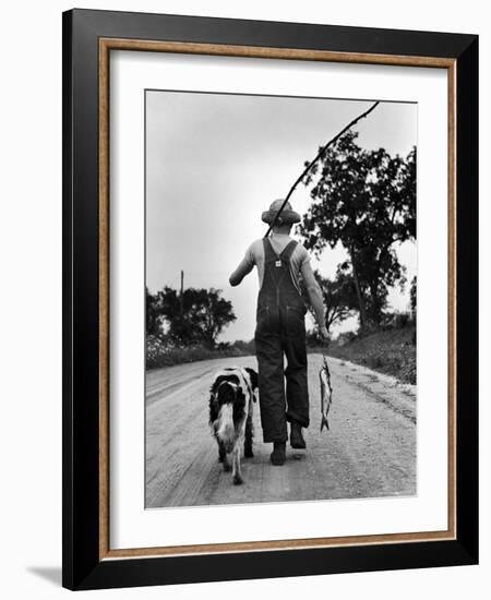 Young Boy and His Dog Walking Home from Fishing-Myron Davis-Framed Photographic Print