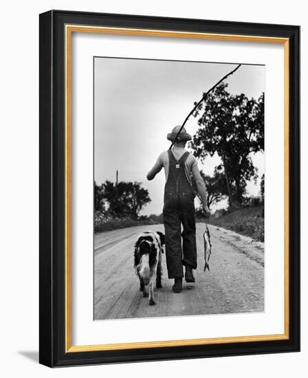 Young Boy and His Dog Walking Home from Fishing-Myron Davis-Framed Photographic Print