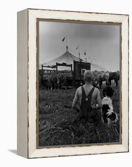 Young Boy and His Dog Watching the Circus Tents Being Set Up-Myron Davis-Framed Premier Image Canvas