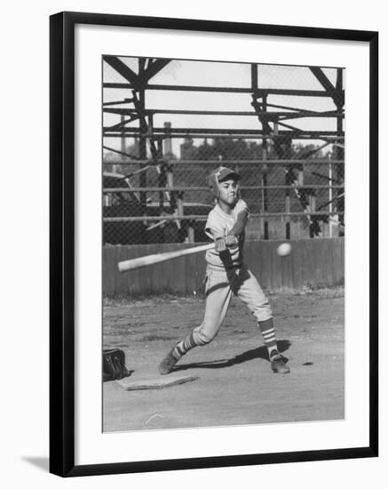 Young Boy Batting in Little League During Game-null-Framed Photographic Print