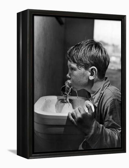 Young Boy Drinking from a Water Fountain-Allan Grant-Framed Premier Image Canvas