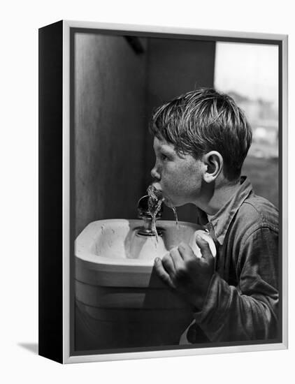 Young Boy Drinking from a Water Fountain-Allan Grant-Framed Premier Image Canvas