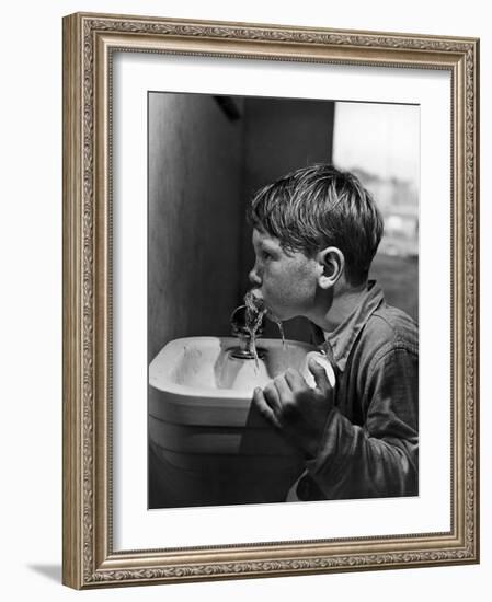 Young Boy Drinking from a Water Fountain-Allan Grant-Framed Photographic Print