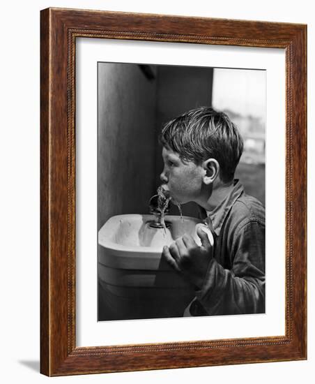 Young Boy Drinking from a Water Fountain-Allan Grant-Framed Photographic Print