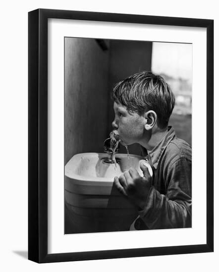 Young Boy Drinking from a Water Fountain-Allan Grant-Framed Photographic Print