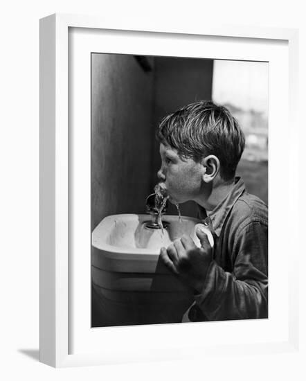Young Boy Drinking from a Water Fountain-Allan Grant-Framed Photographic Print