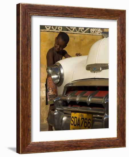 Young Boy Drumming on Old American Car's Bonnet,Trinidad, Sancti Spiritus Province, Cuba-Eitan Simanor-Framed Photographic Print