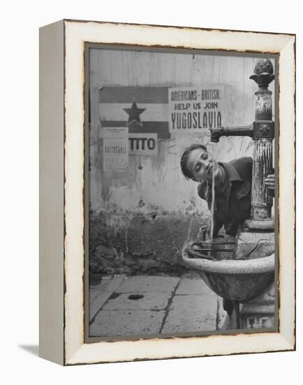 Young Boy Getting a Drink from Fountain in Trieste Region-Nat Farbman-Framed Premier Image Canvas