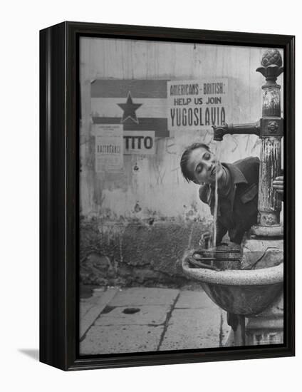 Young Boy Getting a Drink from Fountain in Trieste Region-Nat Farbman-Framed Premier Image Canvas