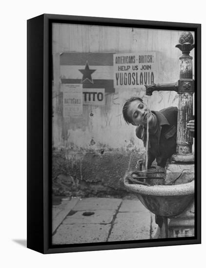 Young Boy Getting a Drink from Fountain in Trieste Region-Nat Farbman-Framed Premier Image Canvas