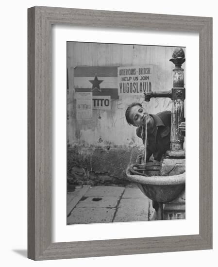 Young Boy Getting a Drink from Fountain in Trieste Region-Nat Farbman-Framed Photographic Print