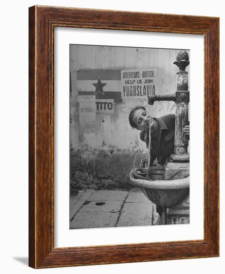 Young Boy Getting a Drink from Fountain in Trieste Region-Nat Farbman-Framed Photographic Print