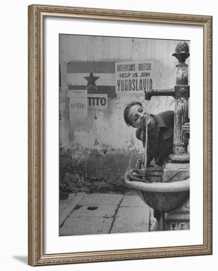 Young Boy Getting a Drink from Fountain in Trieste Region-Nat Farbman-Framed Photographic Print