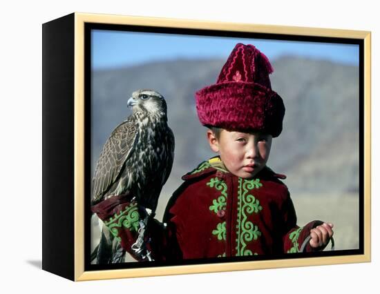 Young Boy Holding a Falcon, Golden Eagle Festival, Mongolia-Amos Nachoum-Framed Premier Image Canvas