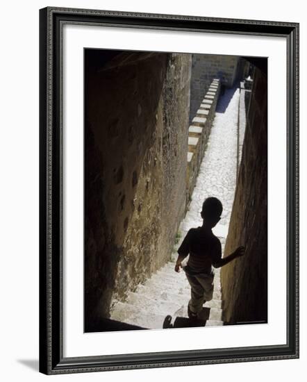 Young Boy in Tower of Castelo de Sao Jorge, Portgual-Merrill Images-Framed Photographic Print