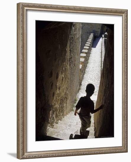 Young Boy in Tower of Castelo de Sao Jorge, Portgual-Merrill Images-Framed Photographic Print