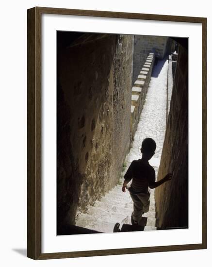 Young Boy in Tower of Castelo de Sao Jorge, Portgual-Merrill Images-Framed Photographic Print