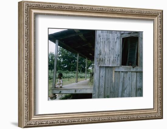 Young Boy on the Porch and a Second Boy Looking Out of Window, on Edisto Island, South Carolina-Walter Sanders-Framed Photographic Print