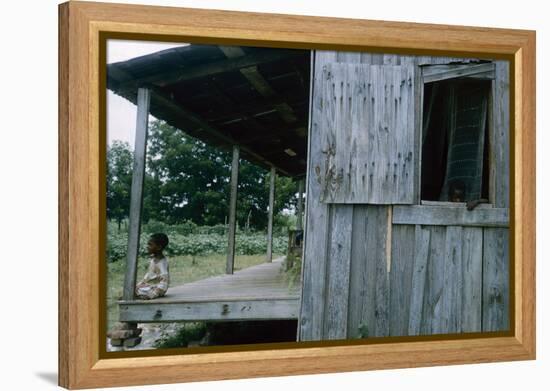 Young Boy on the Porch and a Second Boy Looking Out of Window, on Edisto Island, South Carolina-Walter Sanders-Framed Premier Image Canvas