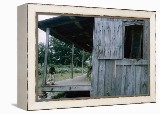 Young Boy on the Porch and a Second Boy Looking Out of Window, on Edisto Island, South Carolina-Walter Sanders-Framed Premier Image Canvas