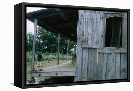 Young Boy on the Porch and a Second Boy Looking Out of Window, on Edisto Island, South Carolina-Walter Sanders-Framed Premier Image Canvas