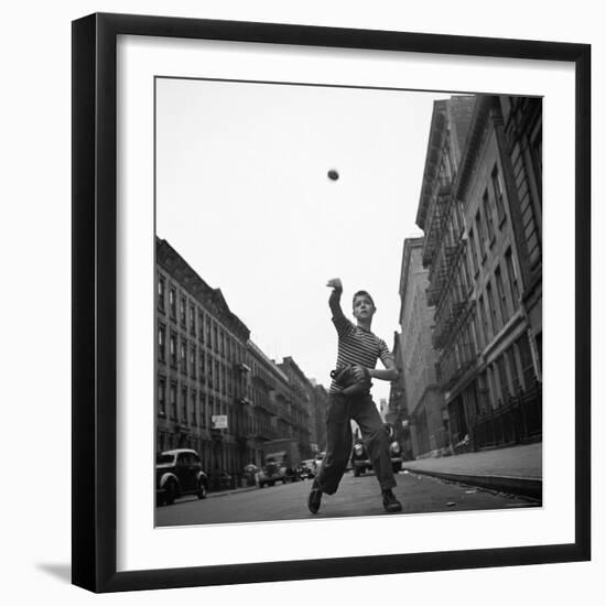 Young Boy Pitching Ball on a City Street-Cornell Capa-Framed Photographic Print