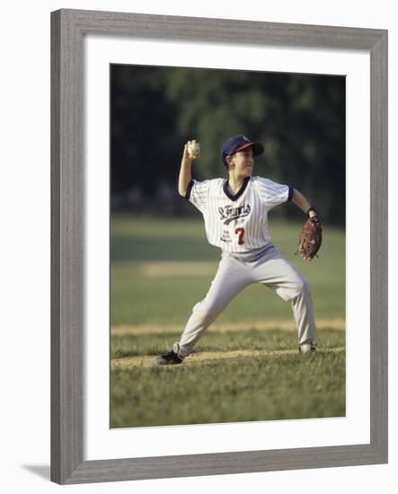 Young Boy Pitching During a Little League Baseball Games-null-Framed Photographic Print