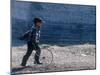 Young Boy Playing on the street of Uelen, Russia's Far East, Siberia-Daisy Gilardini-Mounted Photographic Print