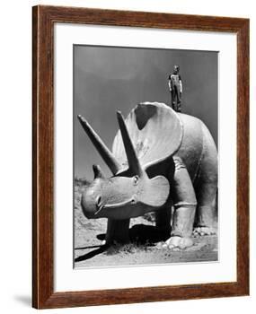 Young Boy Standing Atop Large Statue of Dinosaur in "Dinosaur Park" Tourist Attraction-Alfred Eisenstaedt-Framed Photographic Print