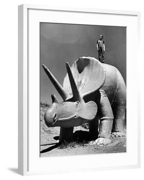 Young Boy Standing Atop Large Statue of Dinosaur in "Dinosaur Park" Tourist Attraction-Alfred Eisenstaedt-Framed Photographic Print