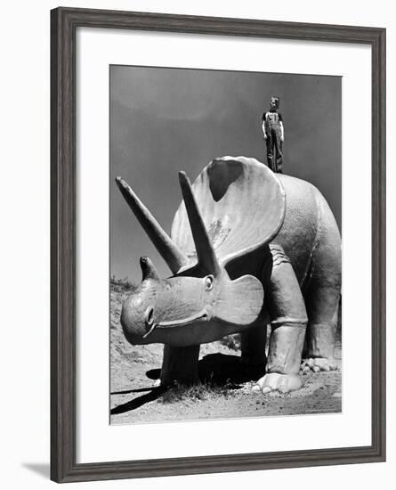 Young Boy Standing Atop Large Statue of Dinosaur in "Dinosaur Park" Tourist Attraction-Alfred Eisenstaedt-Framed Photographic Print