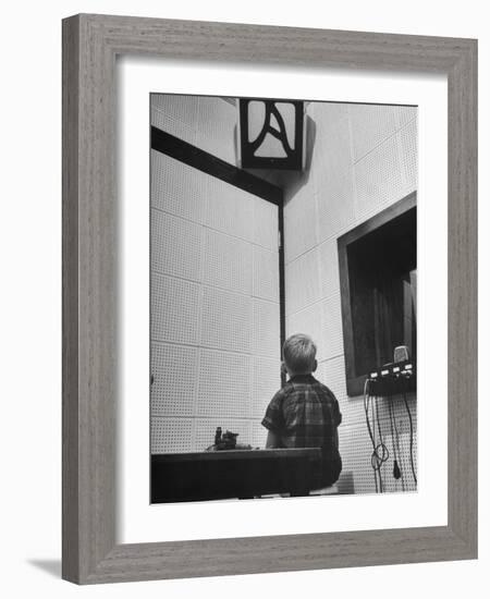 Young Boy Starring at the Loudspeaker Trying to Hear During a Medical Deafness Test-John Dominis-Framed Photographic Print