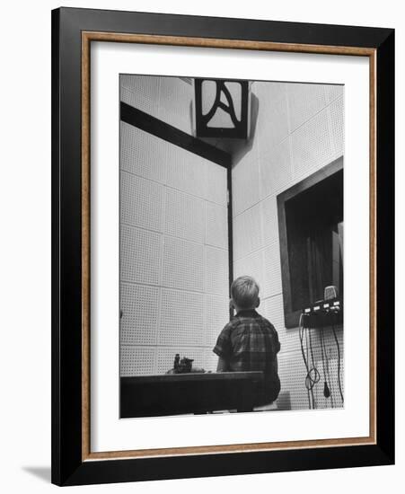 Young Boy Starring at the Loudspeaker Trying to Hear During a Medical Deafness Test-John Dominis-Framed Photographic Print