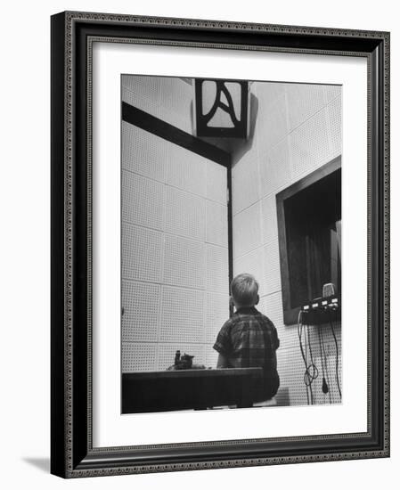 Young Boy Starring at the Loudspeaker Trying to Hear During a Medical Deafness Test-John Dominis-Framed Photographic Print