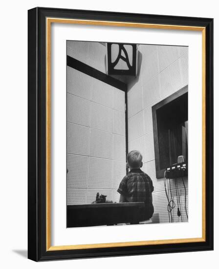 Young Boy Starring at the Loudspeaker Trying to Hear During a Medical Deafness Test-John Dominis-Framed Photographic Print