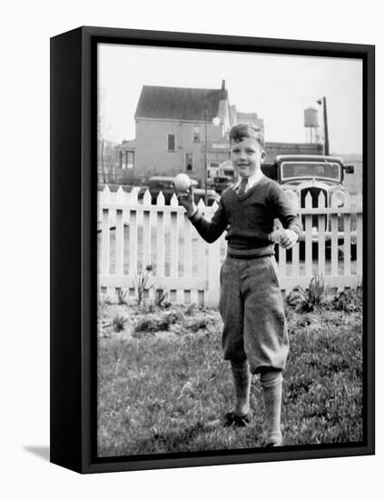 Young Boy Tosses a Baseball in His Backyard, Ca. 1936.-Kirn Vintage Stock-Framed Premier Image Canvas